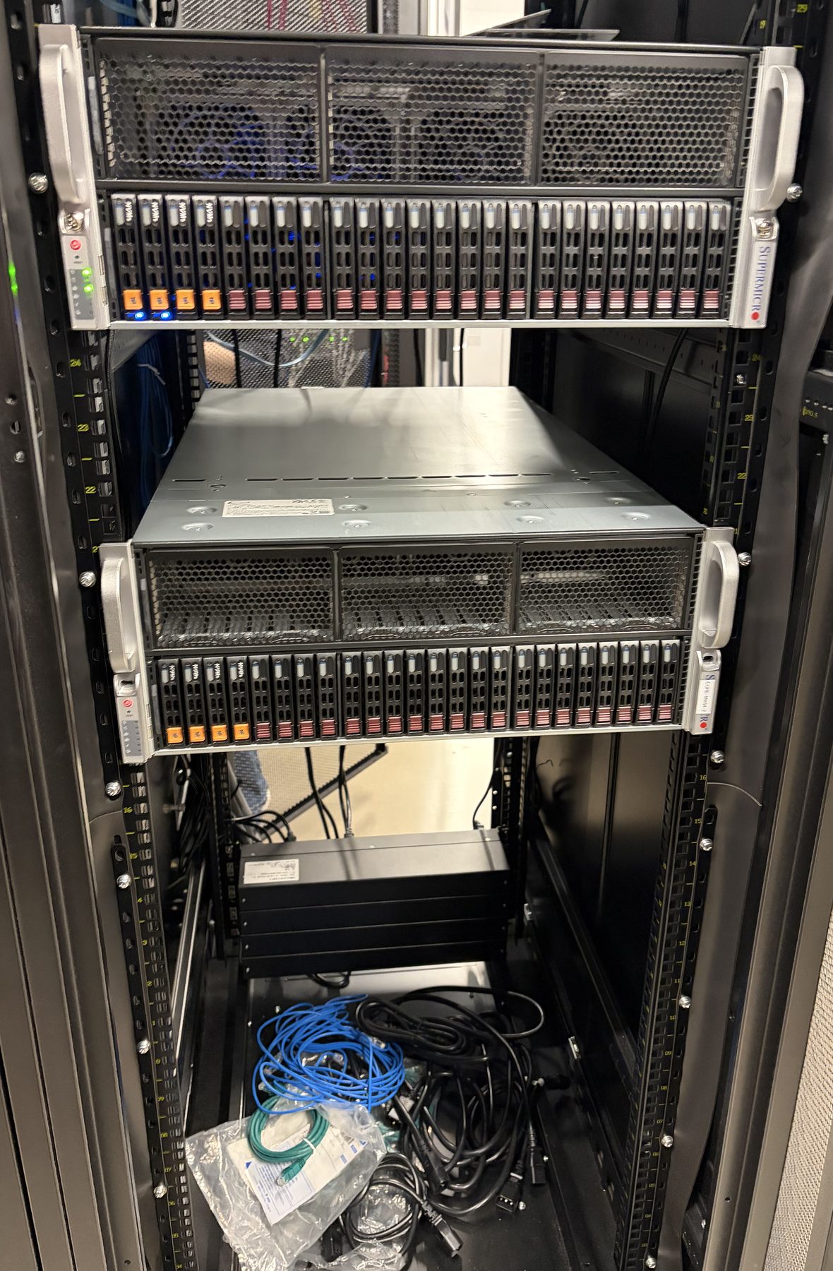 Two Cornami MX64 chassis mounted one above the other in the cabinet.